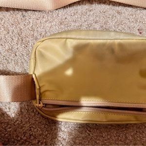 Tan (looks yellow) lululemon bag a little dirty but easily washable